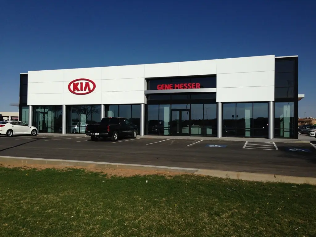 Full glass curtain wall of an auto dealership showroom in Lubbock after cleaning