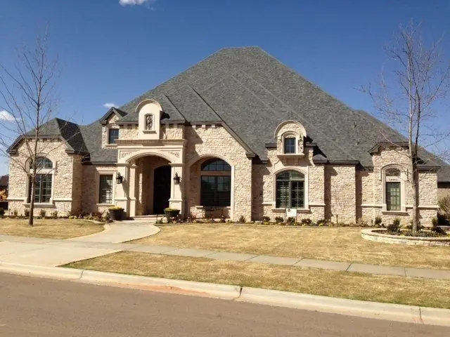 A large stone and brick estate home in Lubbock
