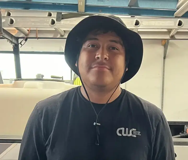 Javi, a crew lead at Caprock Window Cleaning, in a CWC shirt