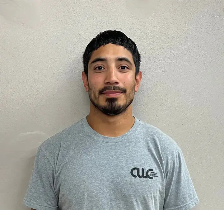 Kyle, a crew lead at Caprock Window Cleaning, in a CWC shirt